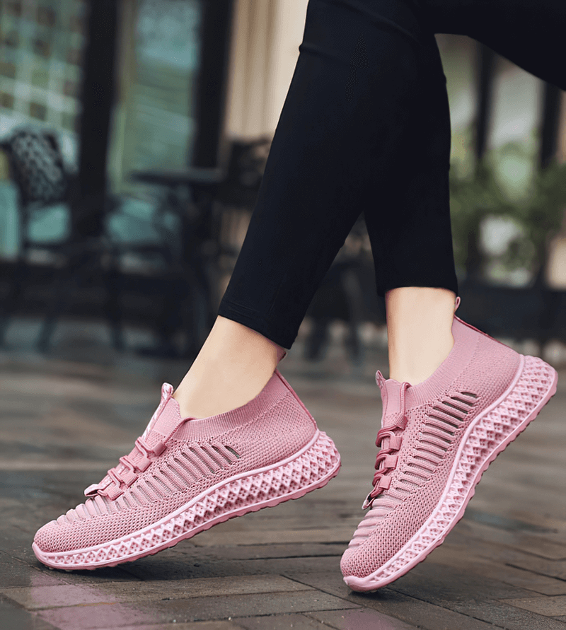 Pink mesh lace-up flat bottom sneakers for women, perfect for casual wear and comfort.